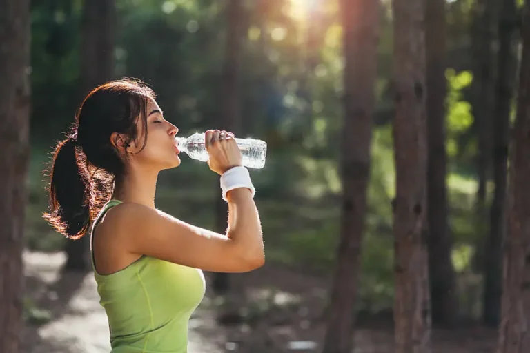Photo of woman drinking water.